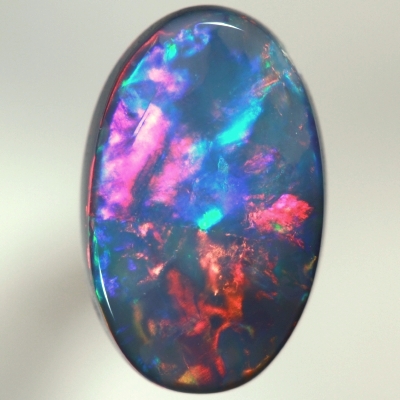 SOLID BLACK OPAL Top quality. Rolling flashes of cherry red and magenta, bright green and purple. SEE VIDEO